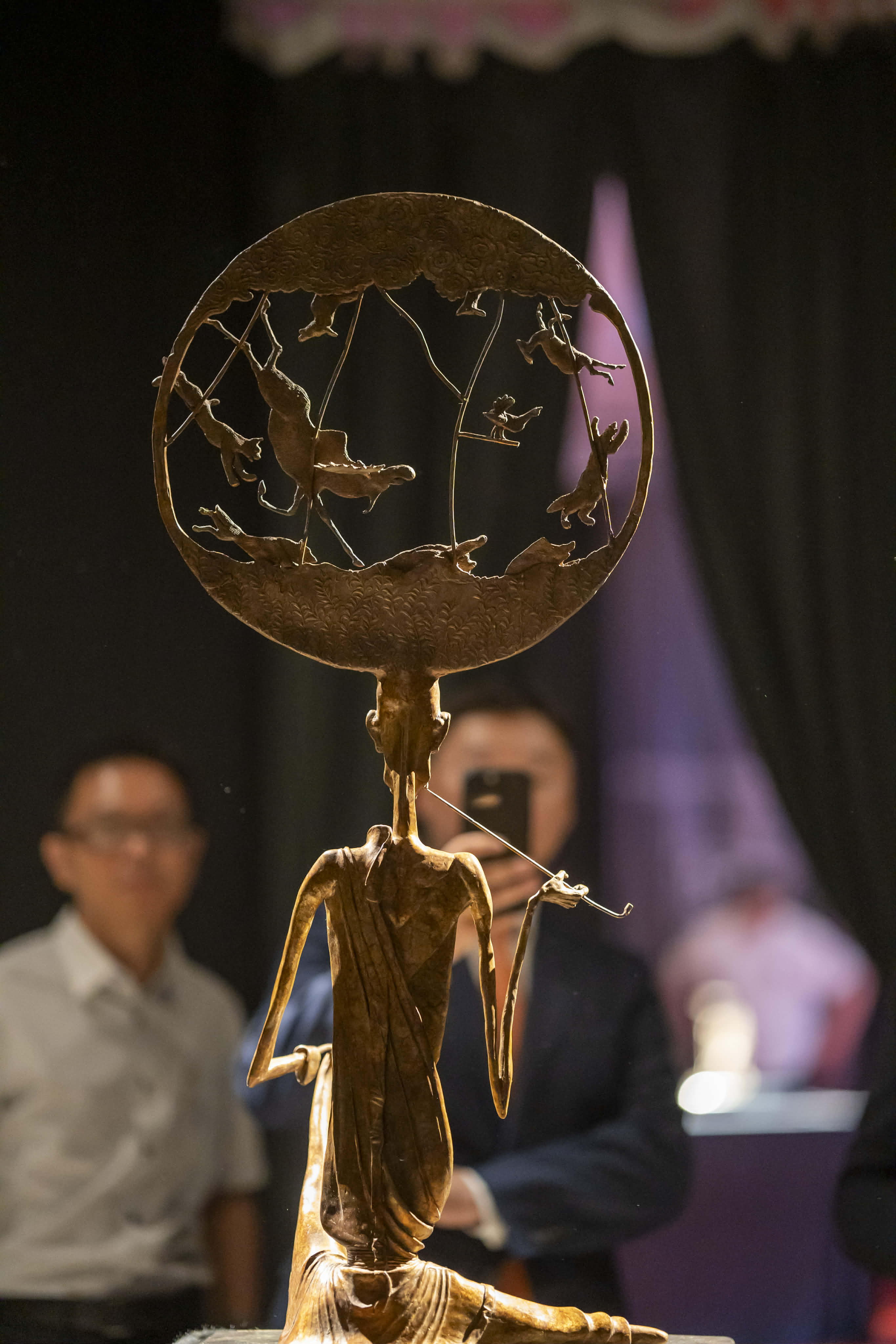 God and Devil sculpture at exhibition